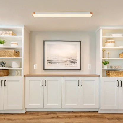 Imogen white 122 cm oval LED ceiling light in a living room
