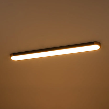 Imogen oval LED ceiling light switched on with warm white glow
