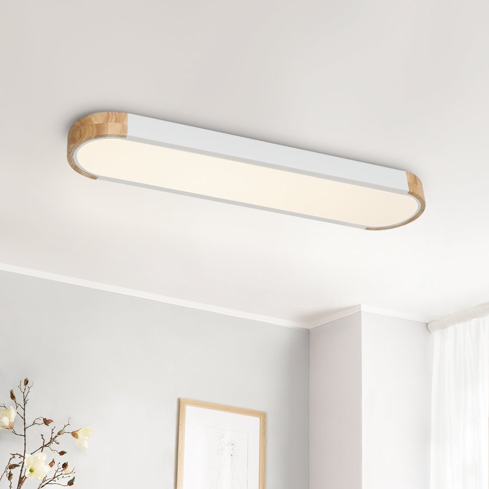 Imogen white oval LED ceiling light in a bright room