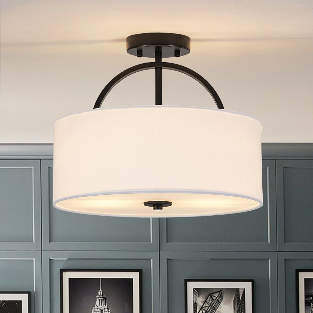 Isadora linen drum ceiling light – in black against a dark panelled wall