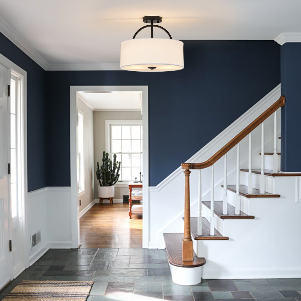 Isadora linen drum ceiling light – in a stairwell with a navy wall