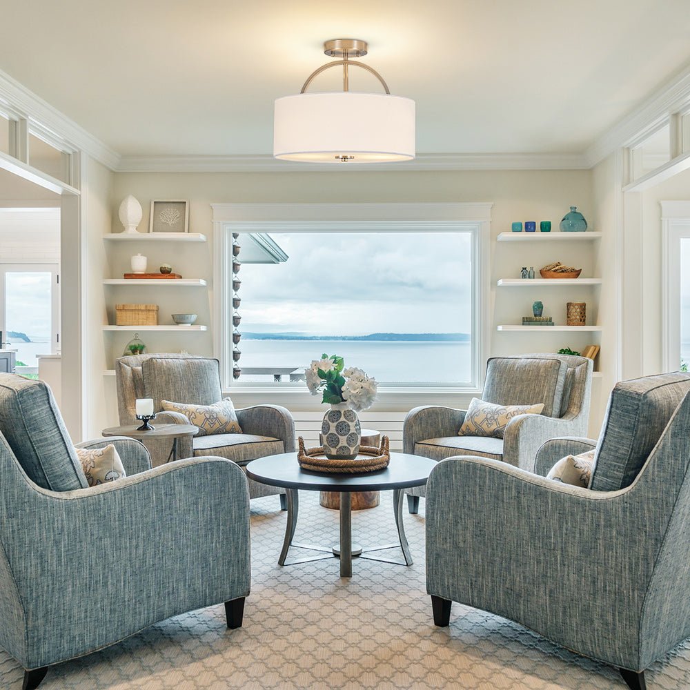 Isadora linen drum ceiling light – in a living room