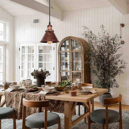 Carlotta copper cone pendant light – in a bright dining room