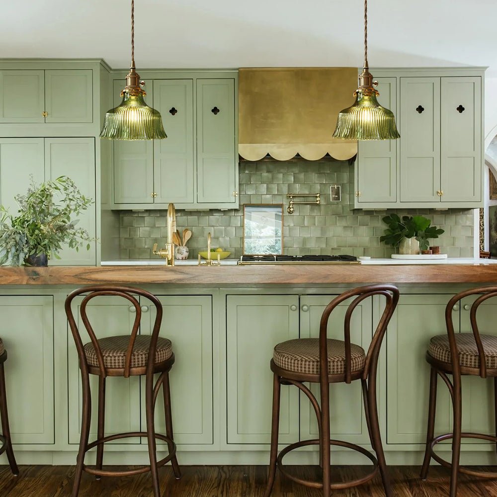 Rosalie flower glass pendant light – two in green over a sage-green kitchen island