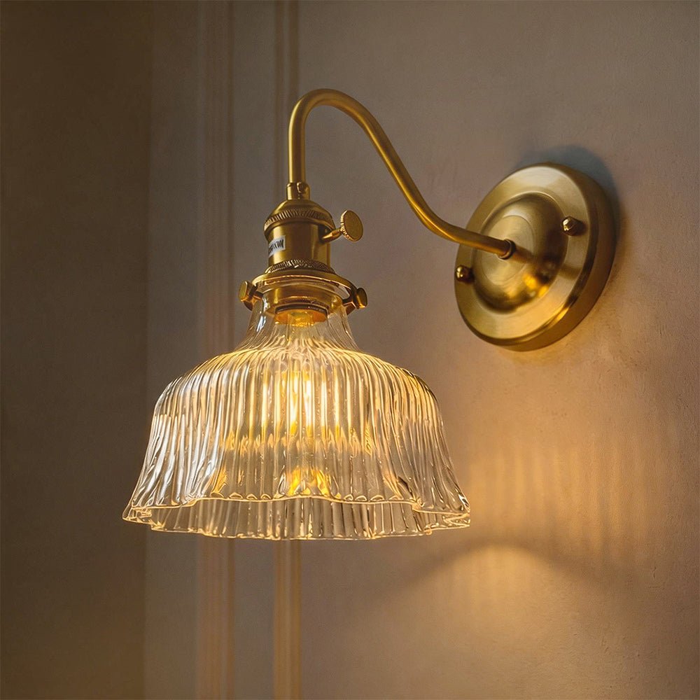 Fiorella flower wall light – lit on a dark wall