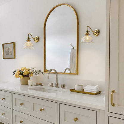 Fiorella flower wall light – beside a bathroom mirror