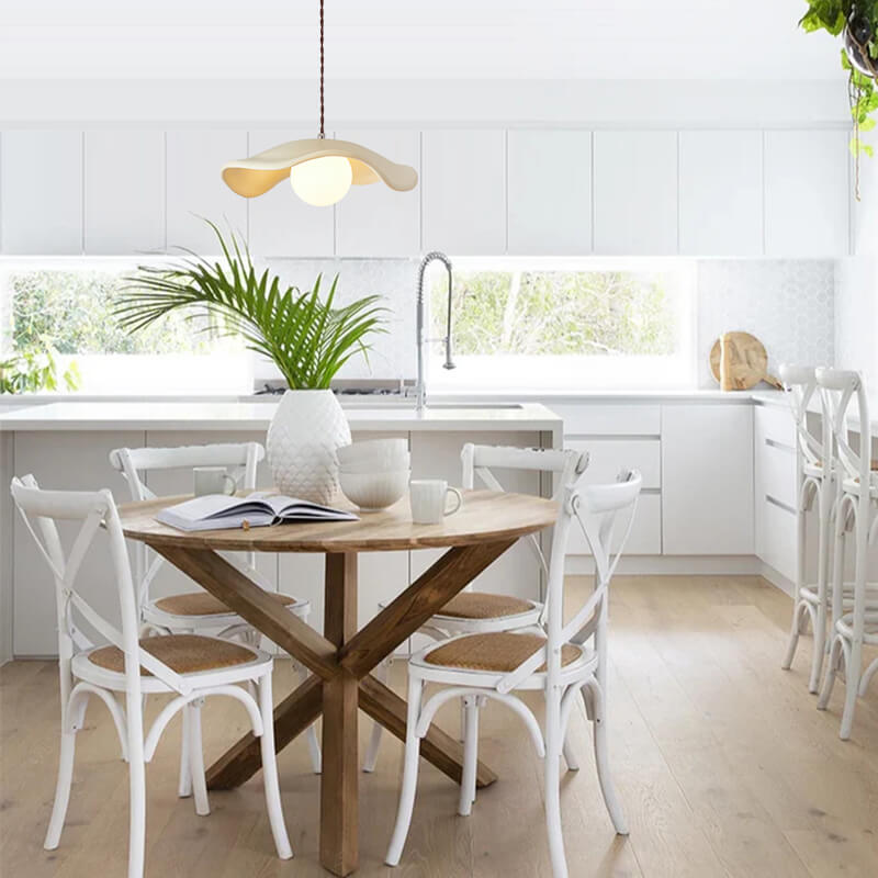 Giselle wavy resin pendant – over a kitchen dining area