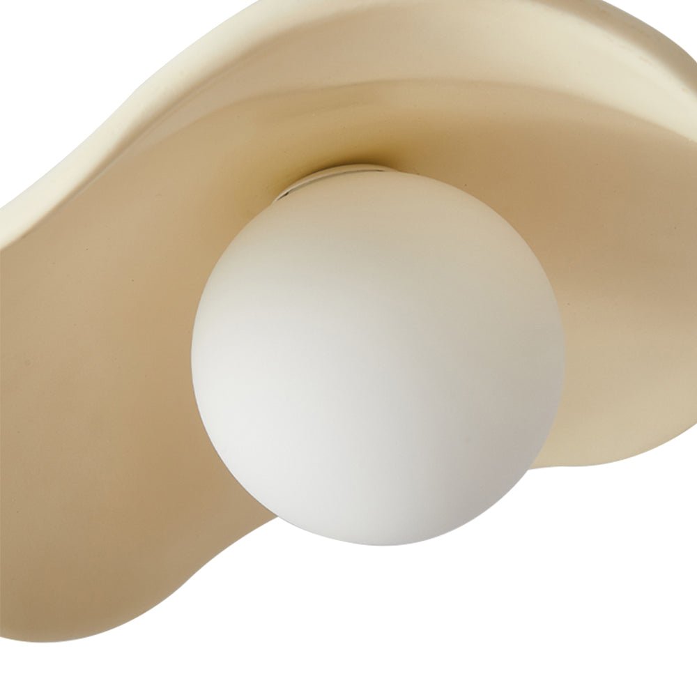 Giselle wavy resin pendant – beige shade and globe close-up