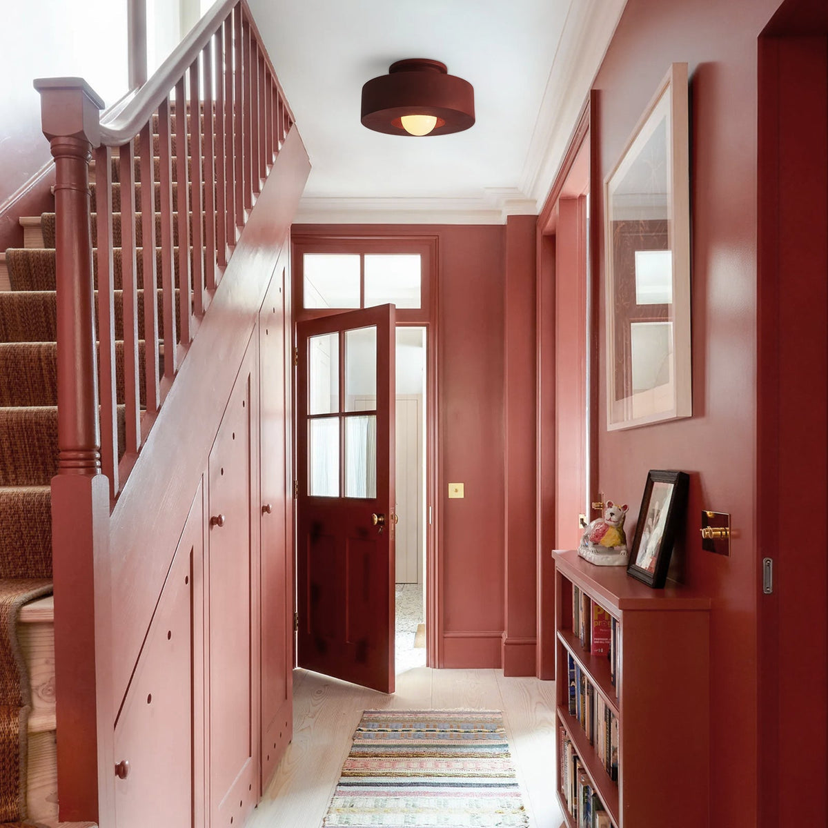 Ottilie wabi sabi ceiling light – in red in a stairwell