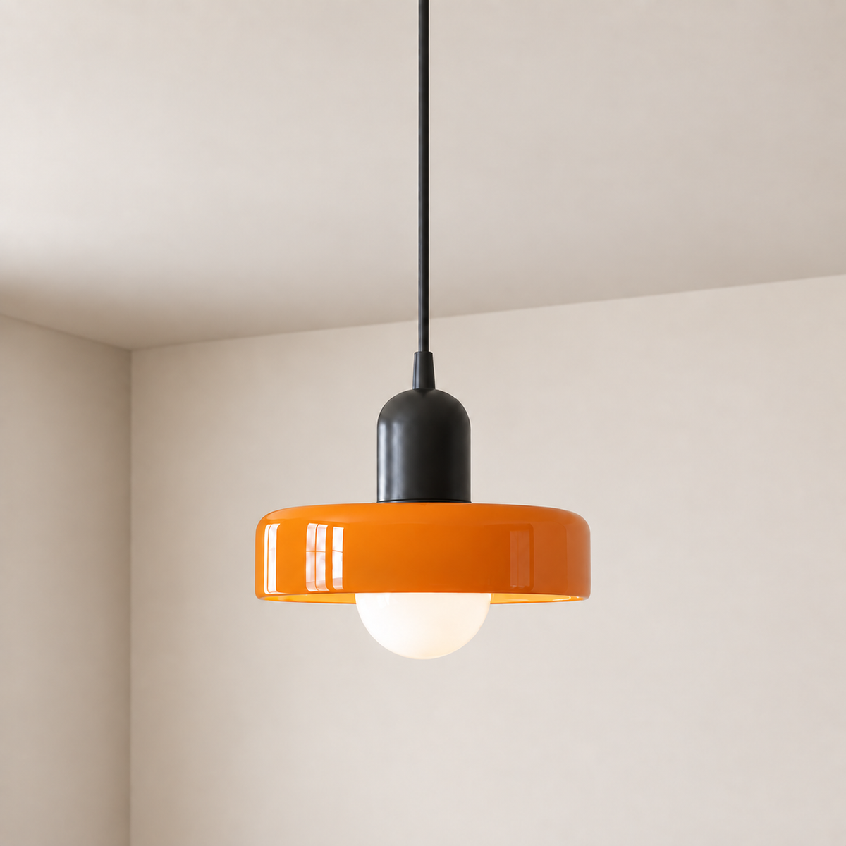 Verona pendant light with an orange matt glass shade on a black fitting